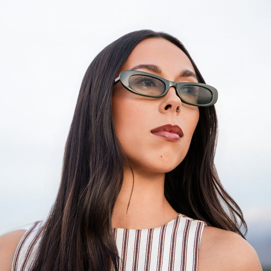 Woman wearing sunglasses with a blurred background