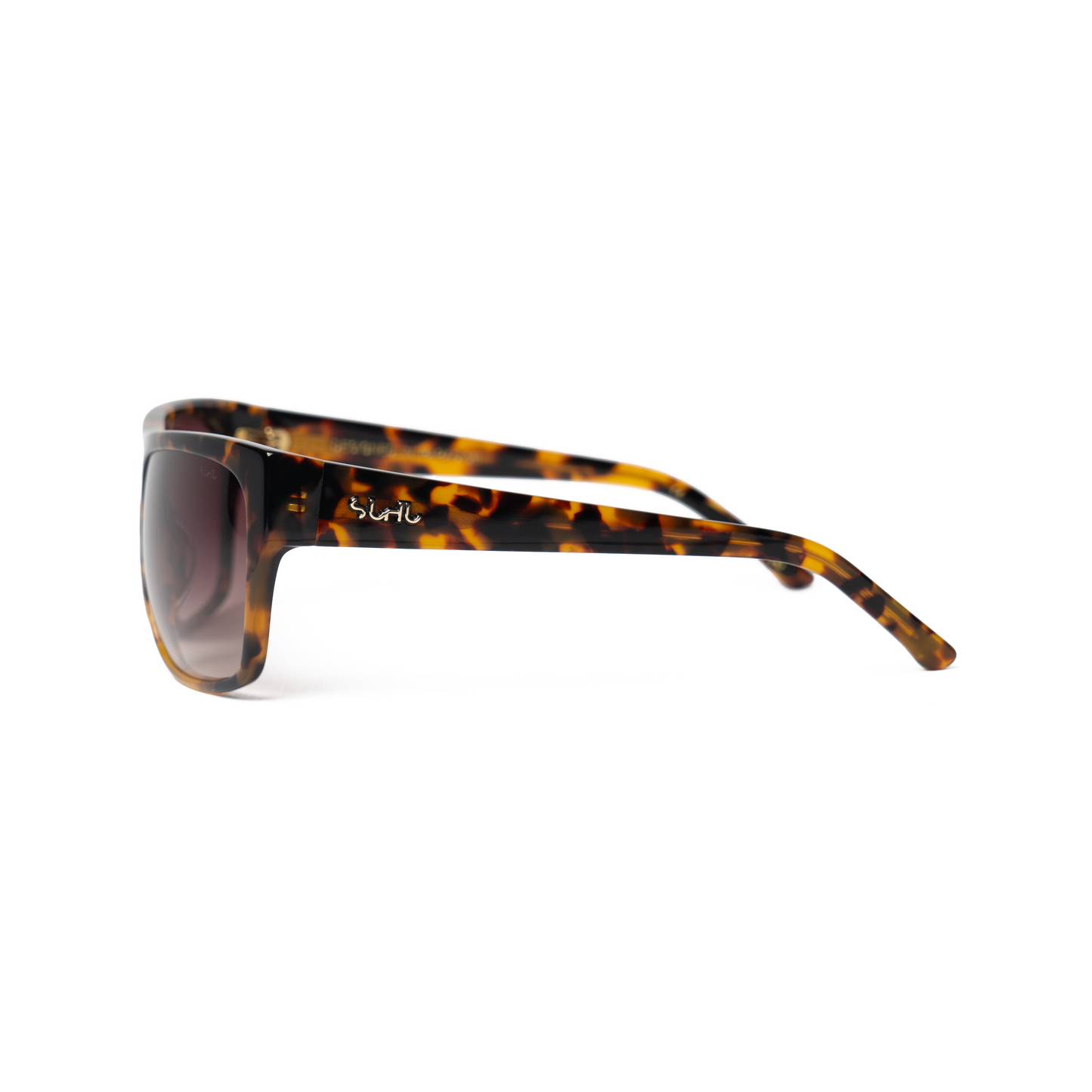Sunglasses shot from a side view of the temples, with tortoiseshell frame and dark lenses on a white background